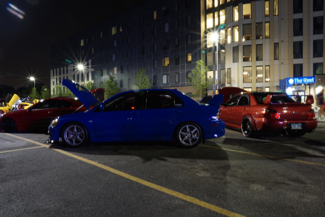 The gang’s all here. Everyone got their pink slips and Eurobeat CDs?